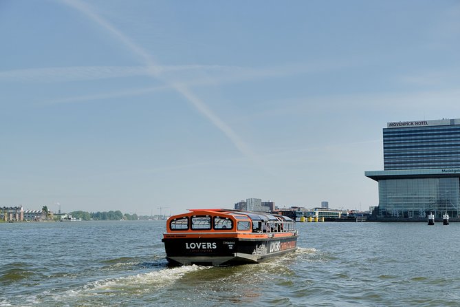 Amsterdam 1h Canal Cruise by Semi-Open Boat with Audio Guide - The Singel Canal and Leafy Banks: A Change of Pace