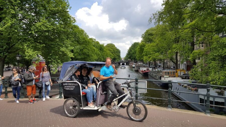 Amsterdam: 2-Hour Sightseeing Tour by Rickshaw - Comfort, Weather, and Hearing Your Guide