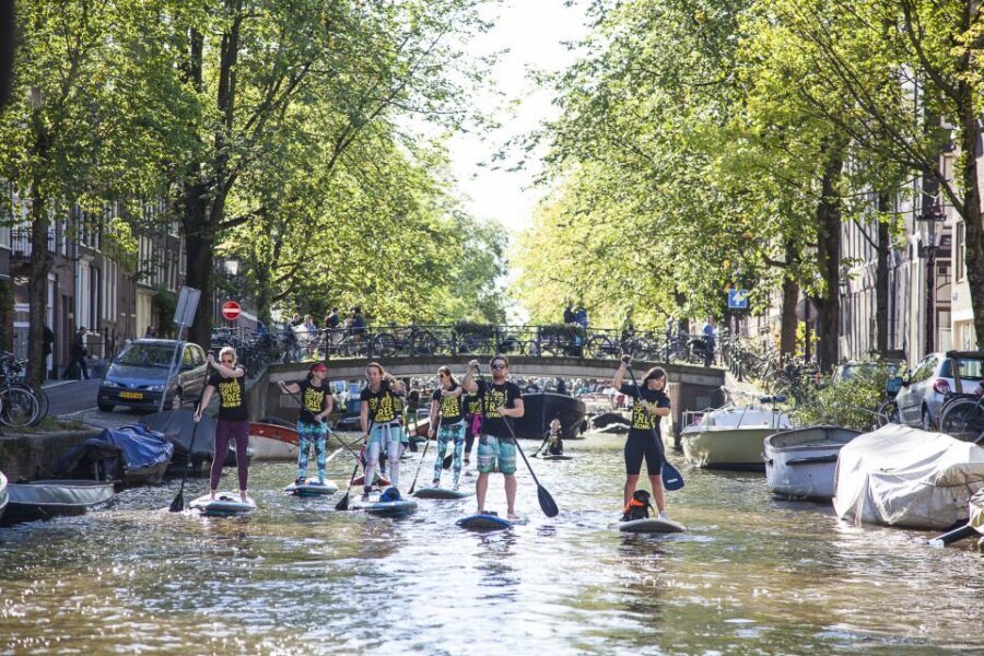 Amsterdam: 2-Hour Stand Up Paddle Board Tour - Crossing the Amstel: The Moment the Tour Turns Into City Views
