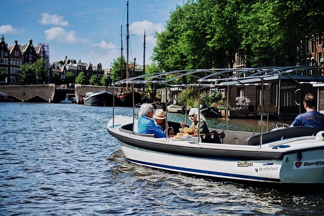 Amsterdam: 60-Minute Guided Private Canal Cruise with Drinks - The 17th-century canal belt and UNESCO stories