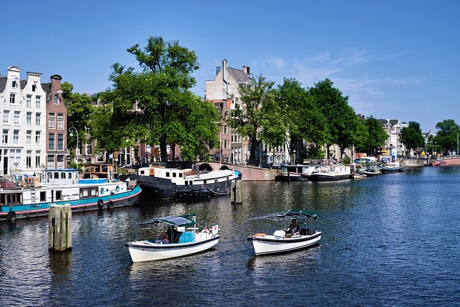 Amsterdam: 60-Minute Guided Private Canal Cruise with Drinks - Seven Bridges on Reguliersgracht: the photo run you’ll actually enjoy