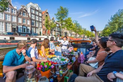 Amsterdam All-Inclusive 90-Minutes Heated Cruise by Captain Jack - Famous Landmarks From the Water: Anne Frank Area, Churches, and Bridges