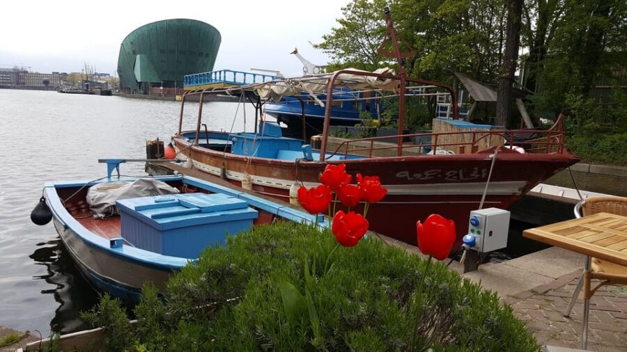 Amsterdam: Canal Cruise on a Wooden Refugee Boat - Tips to make your ride easy: rain gear, snacks, and smart timing