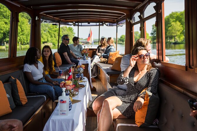 Amsterdam Canal Cruise with Cheese and Wine - Houseboats, museums, and canal history you can picture