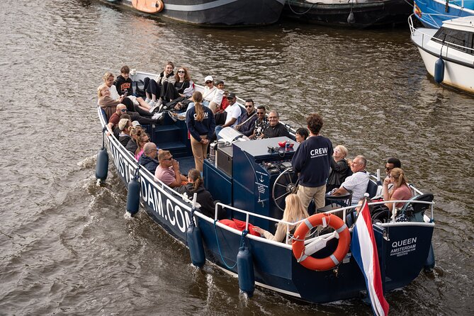 Amsterdam Canal Cruise with Live guide & Two drinks - Central St. - The Old City Centre route: small canals, churches, and the photo-friendly flow