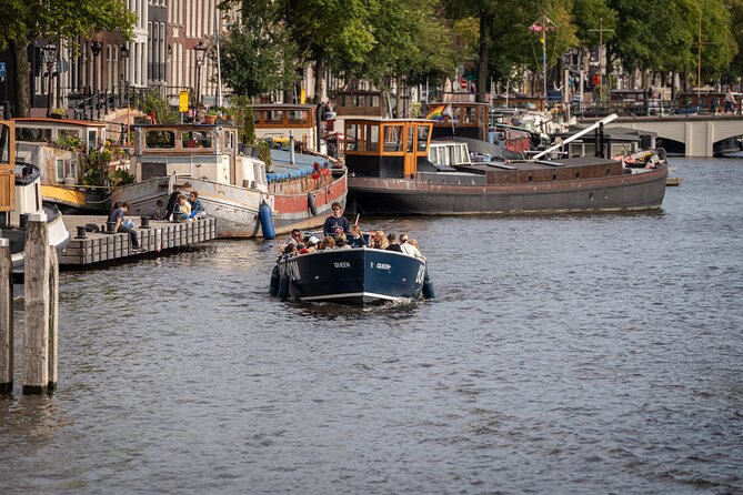 Amsterdam Canal Cruise with Live guide & Two drinks - Central St. - Central Station views: why rail-adjacent sightseeing feels efficient