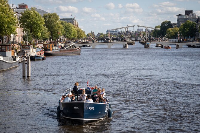 Amsterdam Canal Cruise with Live guide & Two drinks - Central St. - Small group pacing: not a constant talk, just the right amount of story