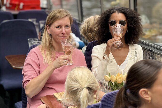Amsterdam Cheese and Wine Canal Cruise - The best photo moments: seven bridges, churches, and canal-belt scale