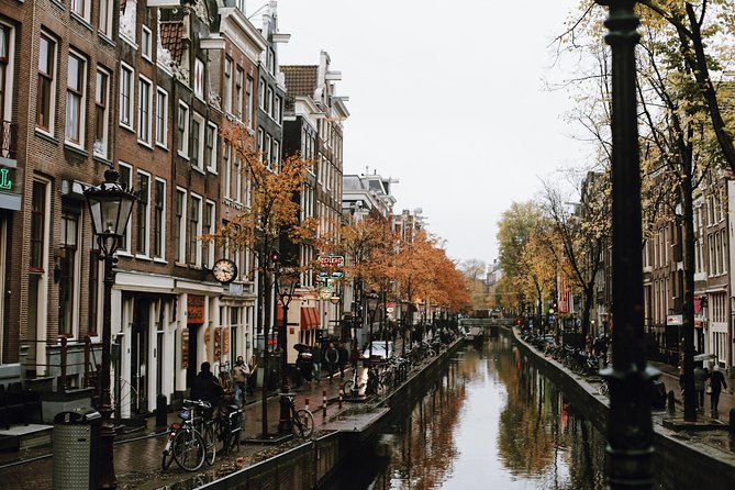 Amsterdam City Center Guided Walking Tour Semi-Private 12ppl Max - Zeedijk and Nieuwmarkt: dikes, markets, and the city gate at De Waag