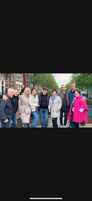 Amsterdam: Day City tour with local Guide in German - Magna Plaza and other popular spots: where the city mixes old and new