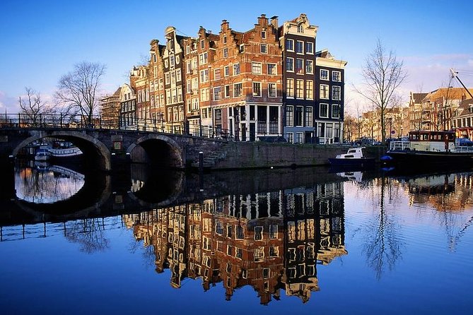 Amsterdam: E-Bike Sightseeing Tour - Canal streets, UNESCO waterways, and the joy of seeing Amsterdam sideways