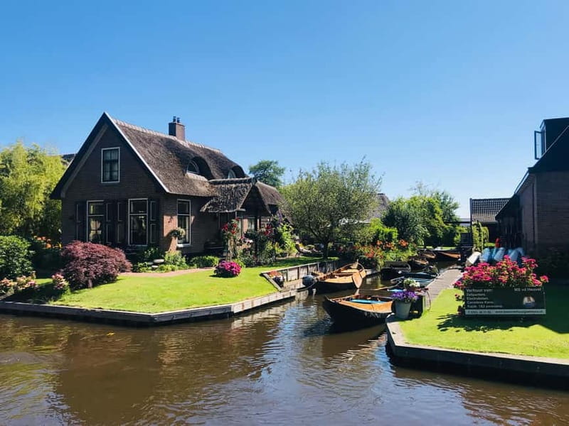 Amsterdam: Giethoorn, Afsluitdijk and Zaanse Schans Day Trip - Zaanse Schans in Zaandam: windmills, Gouda tasting, and wooden shoes