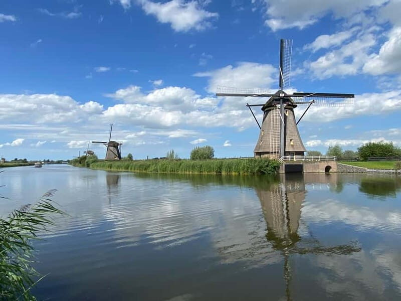 Amsterdam: Kinderdijk, Euromast, Delft and Den Haag Day Tour - Starting from Amsterdam by Van: comfortable, small-group hopping