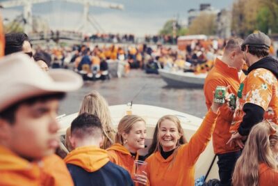 Amsterdam King’s Day Boat Party with Unlimited Drinks 2026 - A 1.5-hour canal cruise with music: what the time feels like