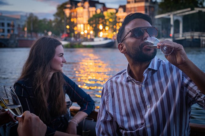 Amsterdam Light Festival Private Cruise With Welcome Drink - Amstel River: Where the Festival Goes Bigger