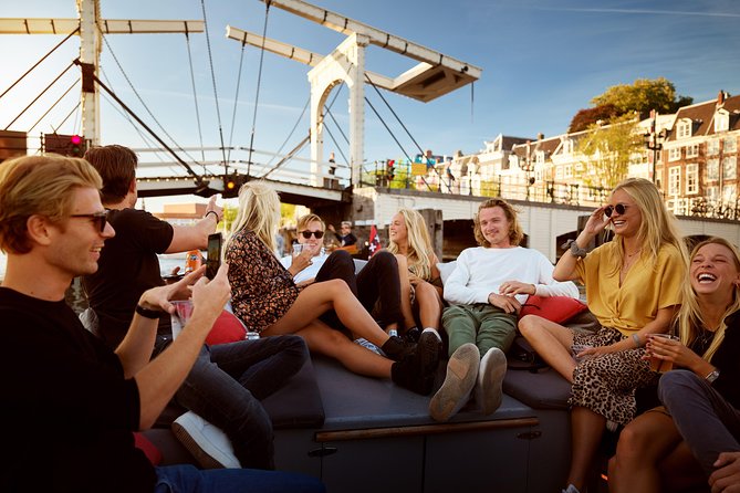 Amsterdam Light Festival: Saloon Boat Cruise + Hot Drinks & Bite - Boarding at the National Maritime Museum: timing and comfort basics
