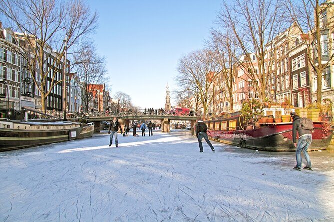 Amsterdam Light Festival Winter Walk with Stroopwafel Workshop - Royal Palace and Munttoren: City-Center Landmarks Without the Headache