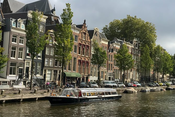 Amsterdam Live Guided Sightseeing Canal Cruise - Herengracht and Prinsengracht: Watching Amsterdam’s Landmark Canals Pass by