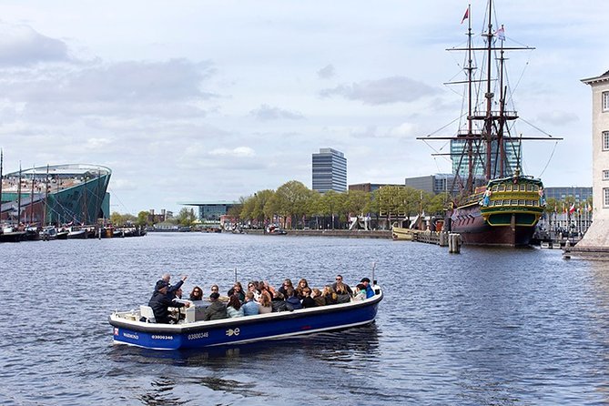 Amsterdam Open Boat Sightseeing Canal Cruise - From Old Icons to Modern Amsterdam: Amstel Hotel, NEMO, and the City’s Mix
