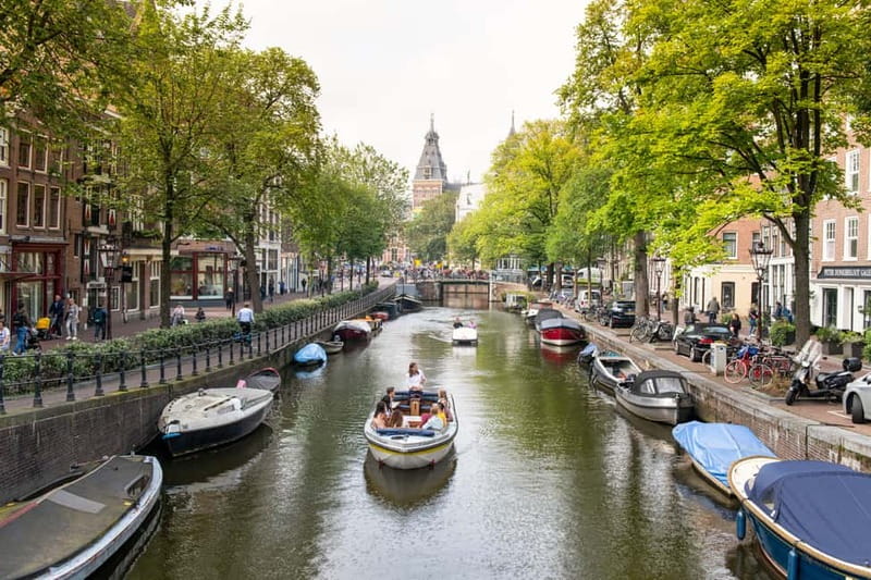 Amsterdam: Open Boat Tour of Canals with Expert Local Guide - What the 1-hour cruise is really like on board