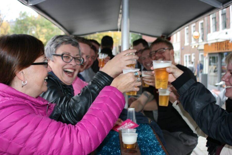 Amsterdam: Party Bike Tour with Beer - Rain and wind protection for a 90-minute ride