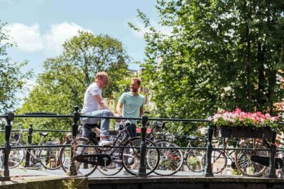 Amsterdam PRIVATE Bike Tour With Locals: Bike & Local Snack Included - Magere Brug (Skinny Bridge): the photo stop that actually fits the ride