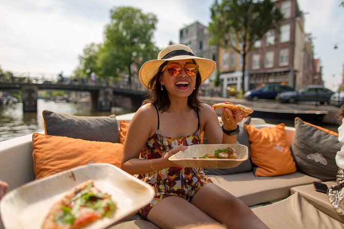 Amsterdam Private Boat Trip with Pizza and Unlimited Drinks - A private canal cruise with pizza and unlimited drinks