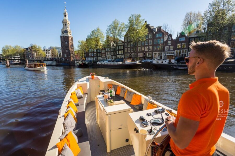 Amsterdam: Private Prosecco Canal Cruise Tour - The canal route: merchant houses and major landmarks in 90 minutes