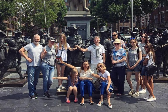 Amsterdam Sightseeing Tour + Hidden Gems + Tastings + PDF guide - Bloemenmarkt and Munttoren: floating flowers plus money-history trivia