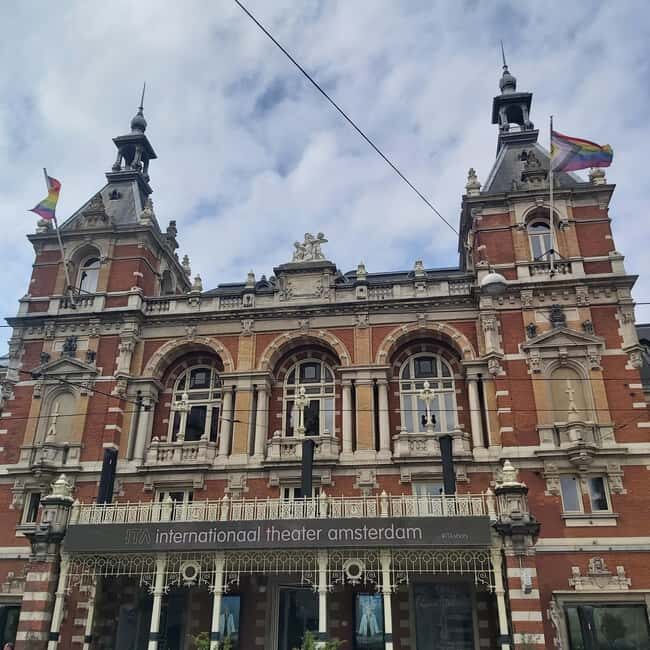 Amsterdam: Spanish Tour Unmasking the Redlight District - Zeedijk to He Hua Tempel: ports, migrants, and photo pauses