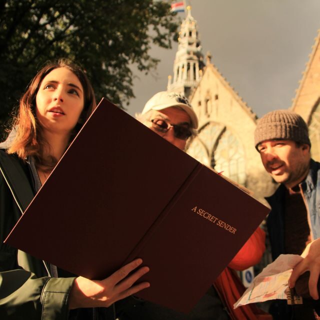 Amsterdam: Treasure Hunt Walking Tour "A Secret Sender" - Torensluis Bridge: a classic Amsterdam setting for tricky clues