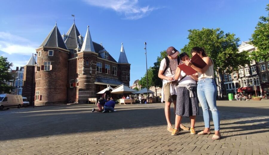 Amsterdam: Treasure Hunt Walking Tour "A Secret Sender" - Mystery City Games: picking up your puzzle backpack