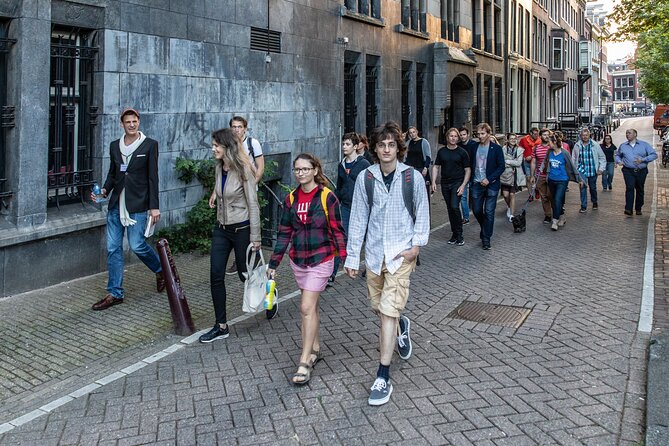 Amsterdam Walking Tour with a local comedian as guide - Oudezijds Voorburgwal: East-India Company buildings and Dutch school lessons