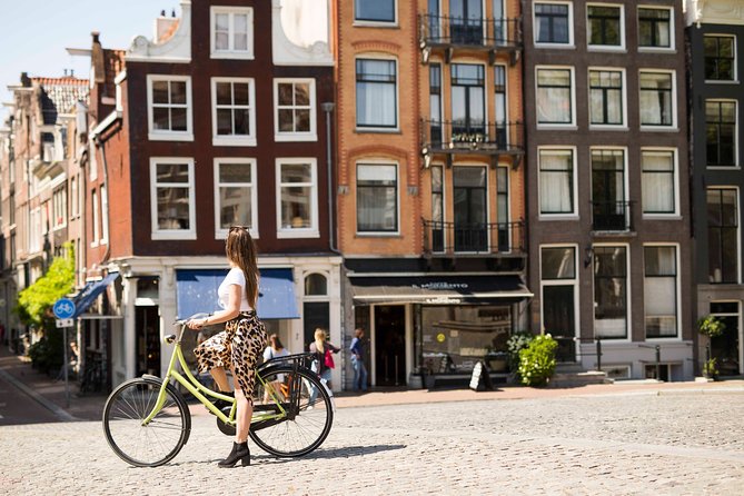 Anne Frank Private Bike Tour in Amsterdam - The Amstel stretch: river views plus WWII context