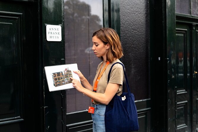 Anne Frank's Story - Guided Walking Tour through Amsterdam - The Dokwerker statue: industry, loss, and a community’s daily life