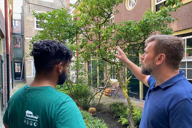 Explore hidden streets with friends - Private Tour - Karthuizerhof courtyard: widows, social housing, and a quiet pause