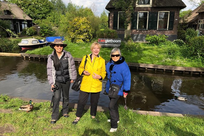 From Amsterdam: Zaanse Schans, Volendam, Giethoorn with Boat Tour - Volendam harbor stroll: wooden houses, regional dress, and easy souvenir time