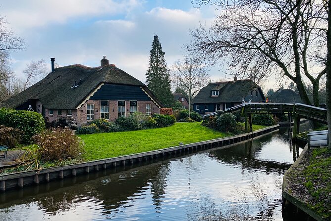 Giethoorn and Zaanse Schans Day Tour Small Group Incl. Boat Ride - Entering Zaanse Schans: cheese, clogs, diamonds, and windmill photos