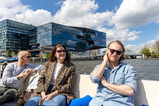 Highlights and Local Insights Canal Cruise Tour in Amsterdam - City Hall, Rokin Canal, and those dancing-house facades