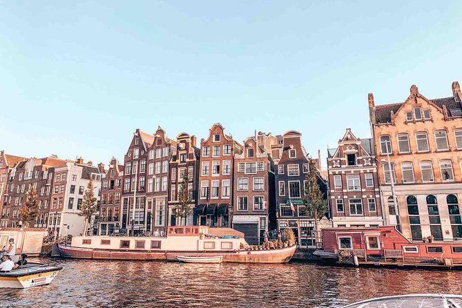 Private Romantic Canal Cruise Amsterdam with Bubbly and Snacks - Amstel River stretches: seven bridges, houseboats, and a theatre sighting