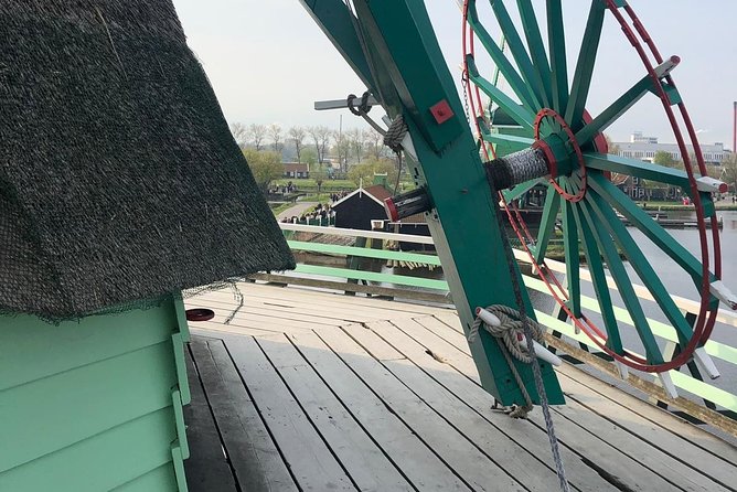 Private Zaanse Schans Windmills and Volendam Tour from Amsterdam - Henri Willig cheese farm: Jersey cows, robot milking, and free Gouda tasting