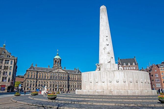 Skip-the-line Royal Palace of Amsterdam Private Guided Tour - Dam Square to Nieuwe Kerk area: the National Monument and Gothic impact
