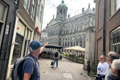 Small Group Walking Tour in Amsterdam with Friendly and Fun Guide - Dam Square and Damstraat: how Amsterdam grew from water to power