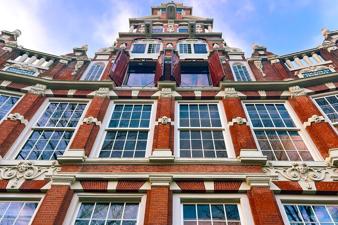 Walking Tour about Golden Age Architecture, private local guide - Torensluis Bridge: Four Mercantile Faces and the Fun of Crooked Houses